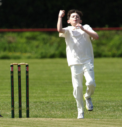 Jacob Burton bowling for Chelmarsh against Chirk