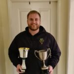 Connor Glendinning with his 1st XI Batting and 1st XI Bowling 2021 trophies